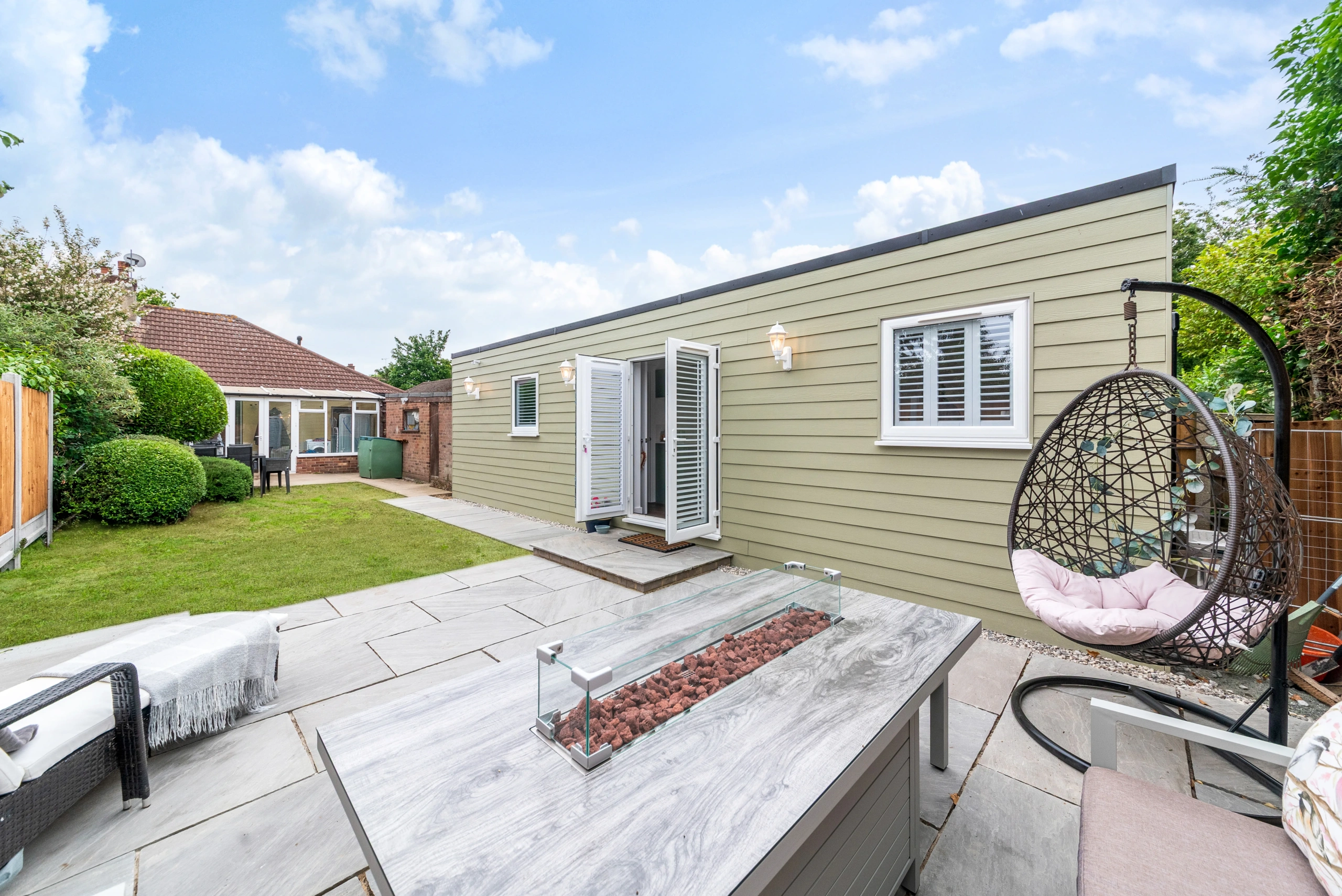 Bedroom and fitted storage in a bespoke Essex garden annexe