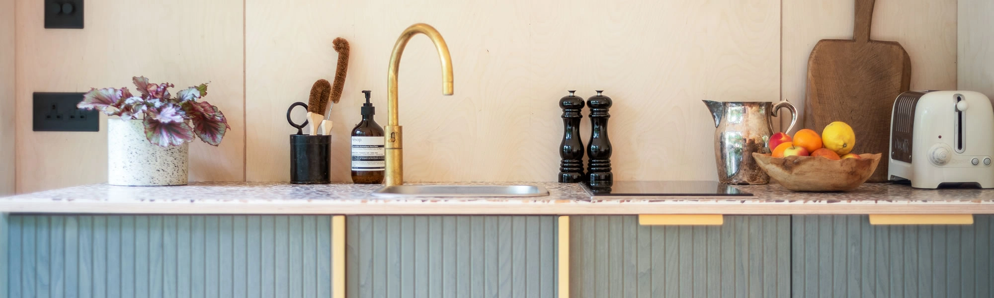 Compact kitchen area inside a self-contained garden annexe for a Berkshire property